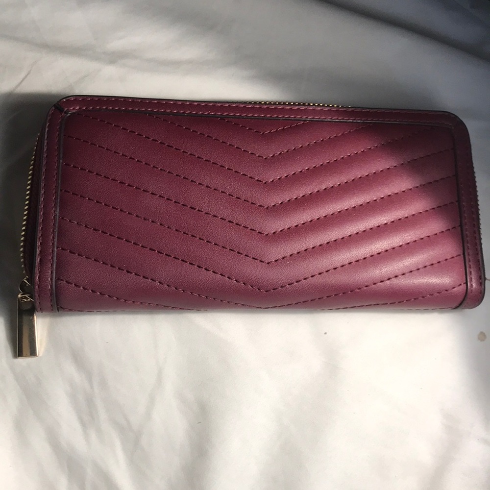 A  •n e w  •d a y. Burgandy wallet